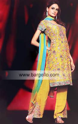 Gold heavily embellished shalwar kameez trouser suit with dupatta