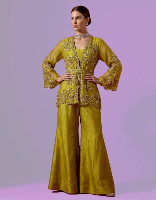 Brass organza peplum jacket with a silk sharara, suited to Pakistani formal dresses USA, Pakistani velvet formal dress, Indian party wear formal dress, Indian cocktail dress with embellishments, formal dresses for Pakistani weddings, Indian receptions, and Muslim women.