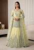 Very Pale Yellow  net shirt paired with a melon pink net lehenga, positioned for Pakistani bridal dresses, bridal wear, bridal outfits, bridal couture, bridal gown and lehenga styles, traditional Pakistani bridal wear, designer bridal dresses, and bridal dresses for Pakistani brides.