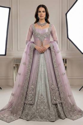 Maverick net jacket with a light silver raw silk lehenga for Pakistani bridal trousseau, embroidered bridal dresses, custom Pakistani bridal outfits, bridal fashion in Pakistan by bridal dress designers in Pakistan, showing latest bridal dress designs and designer bridal dresses for Pakistani brides.