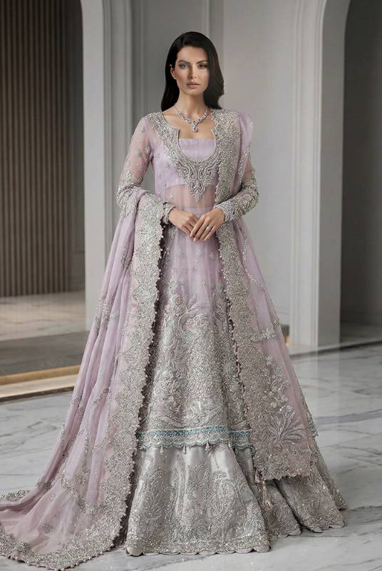 Quartz ametrine net pishwas with a light silver raw silk lehenga, aligned with traditional Pakistani bridal dresses, Pakistani bridal couture, Pakistani bridal lehenga and designer bridal lehenga styles, traditional and embroidered bridal lehenga designs, bridal lehenga trends, and bridal lehenga fashion.
