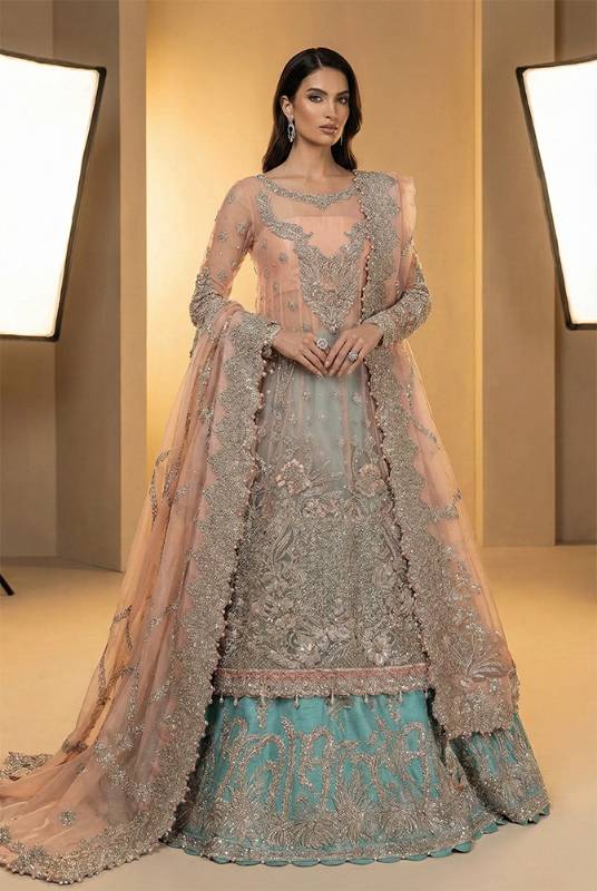 Rose fog net shirt with a tradewind raw silk lehenga, suited to modern nikah dresses and nikah dress designs online, offering nikah outfit ideas and colors, nikah attire for bridesmaids, nikah outfits for bride and groom, dresses for nikah, nikah ceremony dresses, and dresses for baraat.
