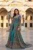 New Teal net gown with berry raw silk pants, presented as a bridal gown for Pakistani brides in USA and a wedding gown for Indian brides in UK, reflecting Pakistani bridal gown designs for weddings in USA, custom Indian bridal gown in UK, designer Pakistani bridal gown, and red Pakistani bridal gown in Norway.