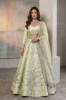 Pale Spring Bud Raw silk Blouse and Lehenga is a Pakistani bridal lehenga choli with heavy embellishments for nikkah ceremony. Find this Nikah ceremony attire at Pakistani bridal lehenga choli stores in Houston and Chicago.